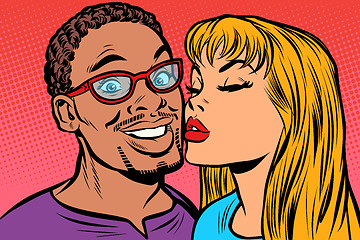 Image showing woman kisses a man. multi-ethnic couple. joy smile