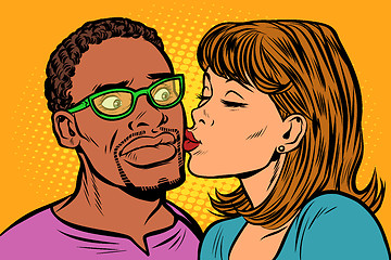 Image showing woman kisses a man. multi-ethnic couple. embarrassment