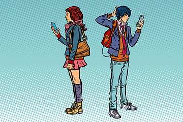 Image showing Young man and girl. Teen couple with smartphones