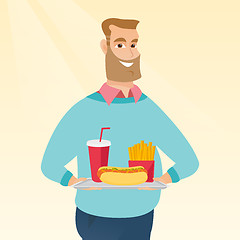 Image showing Man holding tray full of fast food.