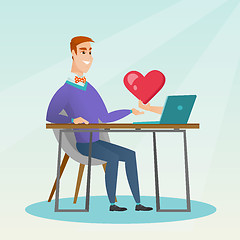 Image showing Young man using a laptop online dating.