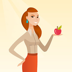 Image showing Young woman holding an apple vector illustration.