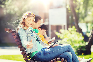 Image showing happy girl with tablet pc computer outdoors