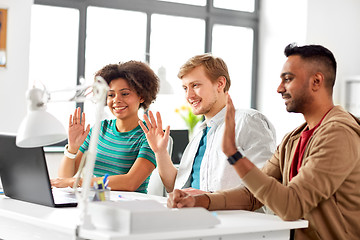 Image showing creative team having video conference at office