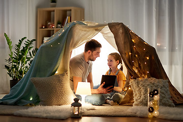 Image showing family with tablet pc in kids tent at home