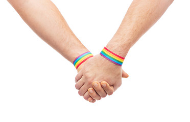 Image showing hands of couple with gay pride rainbow wristbands