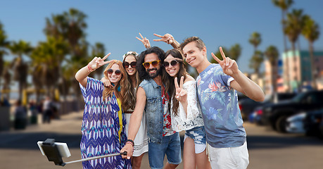 Image showing hippie friends with smartphone on selfie stick