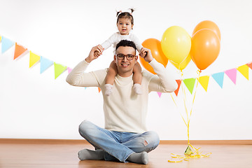 Image showing father and daughter with birthday party balloons