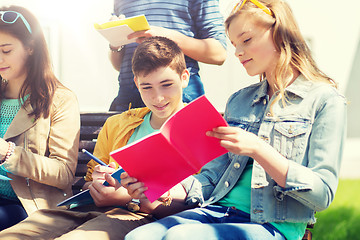 Image showing group of students with notebooks at school yard