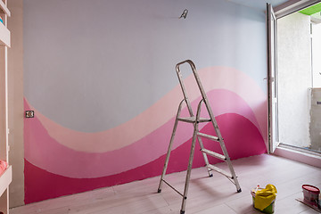 Image showing Repair in the children\'s room, original painting of the walls in light blue and pink