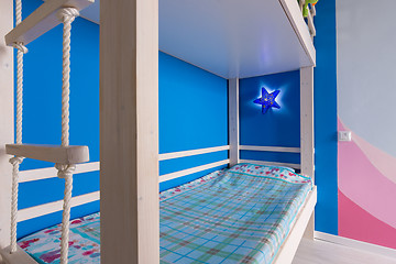 Image showing Lower berth and rope ladder to the top of the children\'s bunk bed