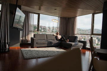 Image showing woman using tablet in beautiful apartment