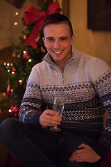 Image showing Happy young man with a glass of champagne