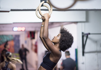 Image showing black woman doing dipping exercise