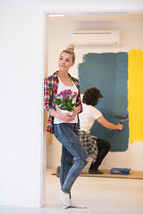 Image showing happy young couple doing home renovations