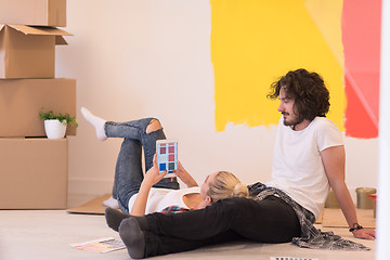 Image showing Happy young couple relaxing after painting