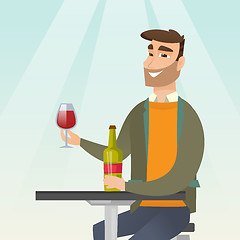 Image showing Man drinking wine in the restaurant.