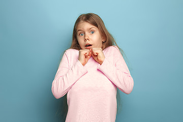 Image showing The fear. Teen girl on a blue background. Facial expressions and people emotions concept