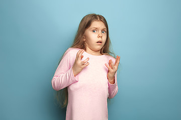 Image showing The fear. Teen girl on a blue background. Facial expressions and people emotions concept