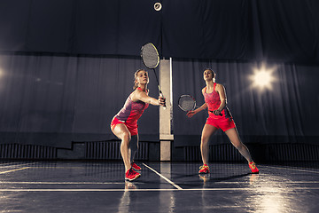 Image showing Young women playing badminton at gym