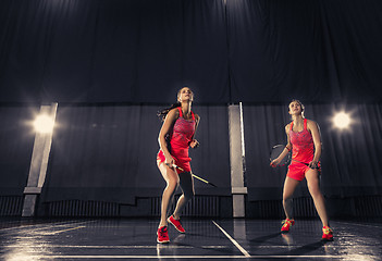 Image showing Young women playing badminton at gym