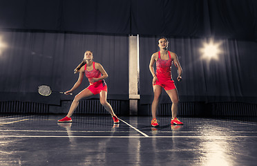 Image showing Young women playing badminton at gym