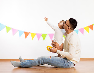 Image showing happy father and little daughter at birthday party