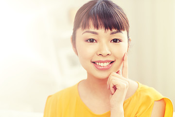 Image showing happy asian young woman at home