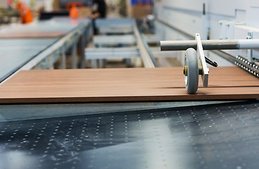 Image showing wooden board on conveyer at furniture factory