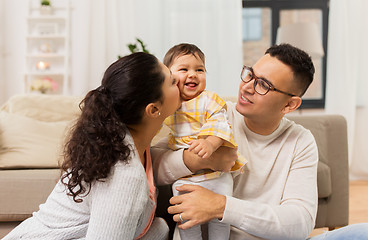 Image showing happy family with baby daughter at home