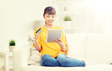 Image showing happy asian woman with tablet pc and credit card