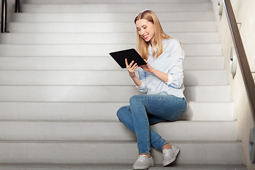 Image showing woman or student with tablet pc sitting on stairs