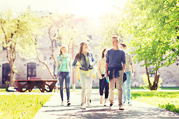 Image showing group of happy teenage students walking outdoors