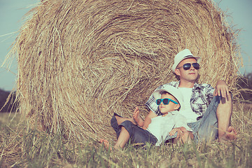 Image showing Father and son playing in the park at the day time.