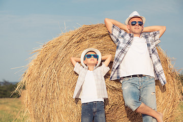 Image showing Father and son playing in the park at the day time.