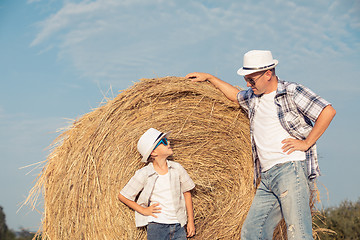 Image showing Father and son playing in the park at the day time.