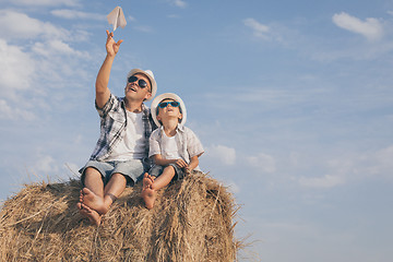 Image showing Father and son playing in the park at the day time.