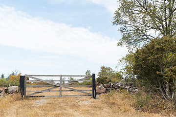 Image showing Closed old wooden gate