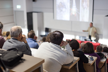 Image showing Business speaker giving a talk at business conference event.