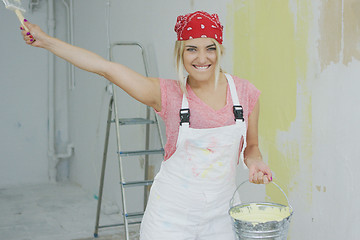 Image showing Lively young female with bucket and brush 