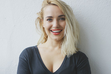 Image showing Attractive cheerful young blond woman