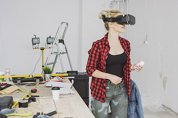 Image showing Female in virtual reality headset in workshop 