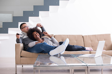 Image showing multiethnic couple relaxing at home