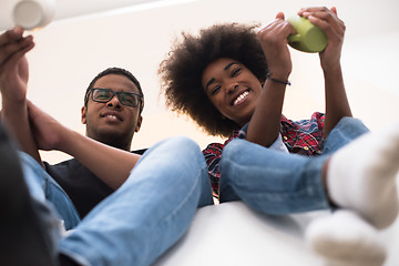 Image showing couple having break during moving to new house