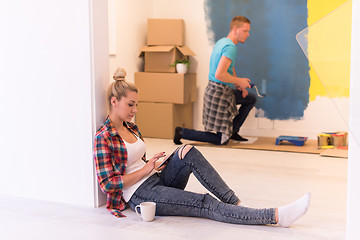 Image showing couple doing home renovations