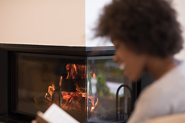 Image showing black woman at home reading book