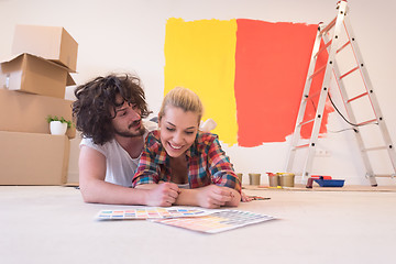 Image showing Happy young couple relaxing after painting