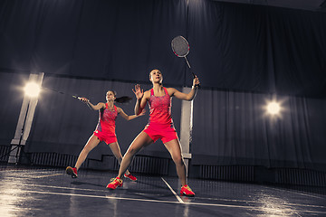 Image showing Young women playing badminton at gym