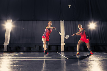 Image showing Young women playing badminton at gym