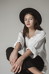 Image showing Stylish young teen girl over gray background
